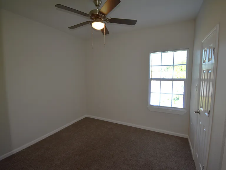 Bedroom 3 with adjacent bath unseen to the right. The 2nd bedroom is similar in size.