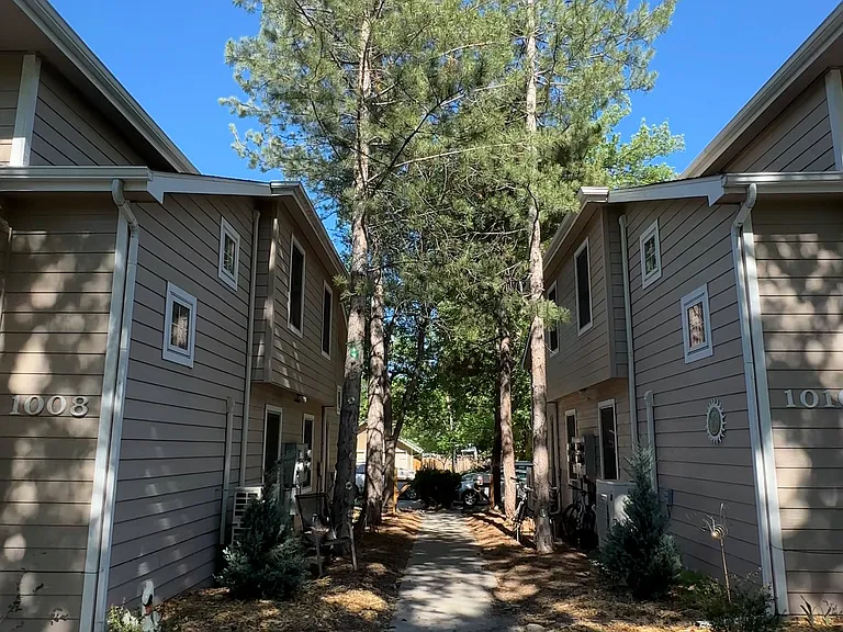 Mature trees and landscaped walkways give Remington Place a peaceful atmosphere near campus.