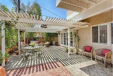 backyard and trellis covered patio off the living area - great f