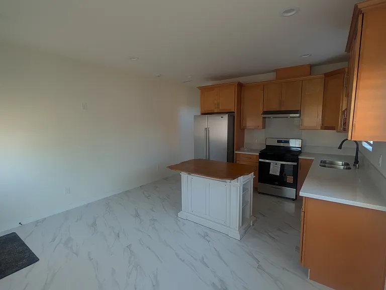 View of the Kitchen Area & Living Room