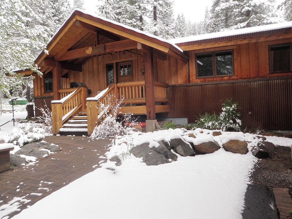 Alaska yellow cedar and corrugated steel siding. Front deck has a propane grill. Our home is known as the Heart of Squaw Valley.