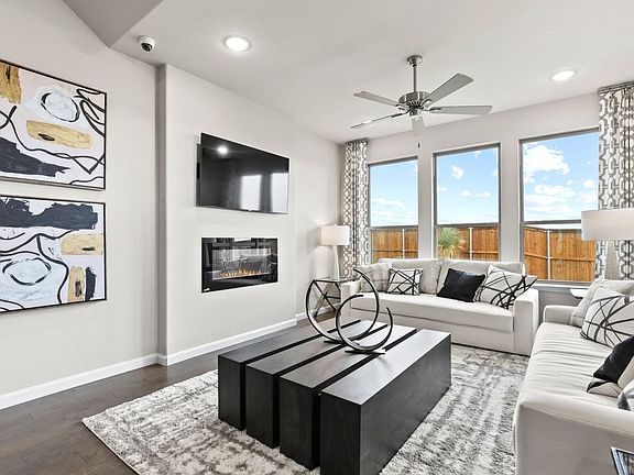 Living room in the Wimbledon home plan by Trophy Signature Homes - REPRESENTATIVE PHOTO