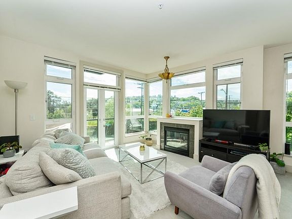 Light filled SW Corner with Lush Green views!