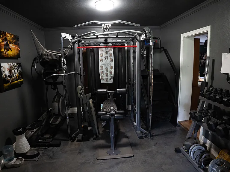 technically a formal dining area, space currently used as an exercise room. This space can be covered with barn doors