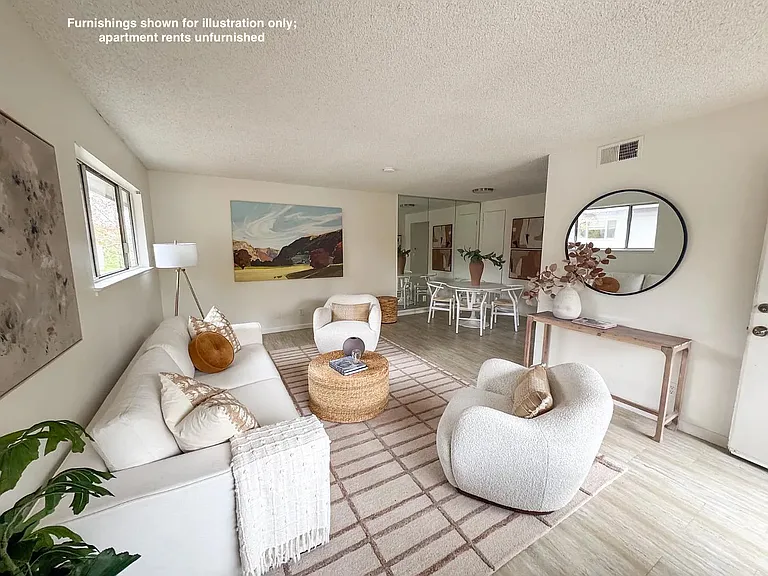 Living room (staged)* note that furnishings are shown just for illustration and are not included in rental. The rental is unfurnished.