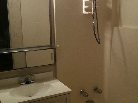 Clean bathroom with full tub