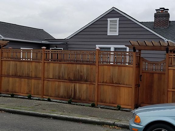 Front of the house which is fenced