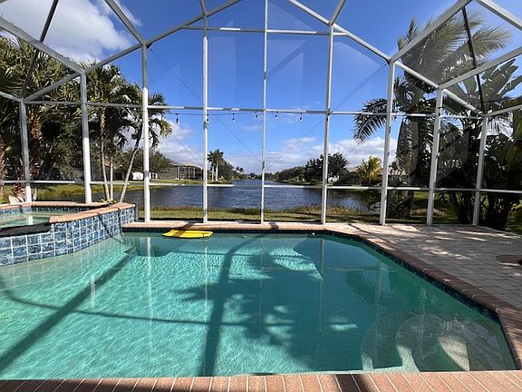 Large, Extended-Height Pool Cage with stunning lake views