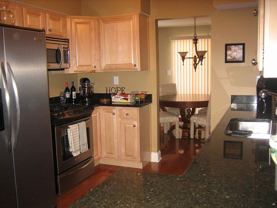 Custom Kitchen with granite countertops and new stainless steel appliances