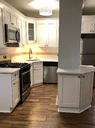 Closer look at kitchen with stainless steel appliances