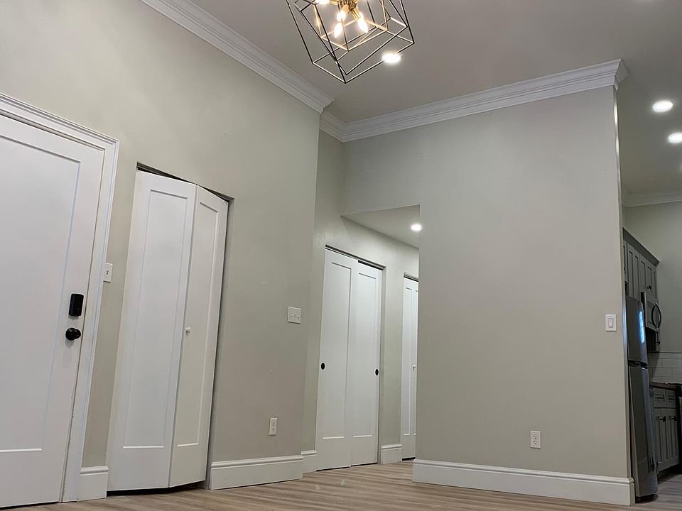 A 3rd shot of the living room, notice the abundant closet space and the openness to the kitchen.