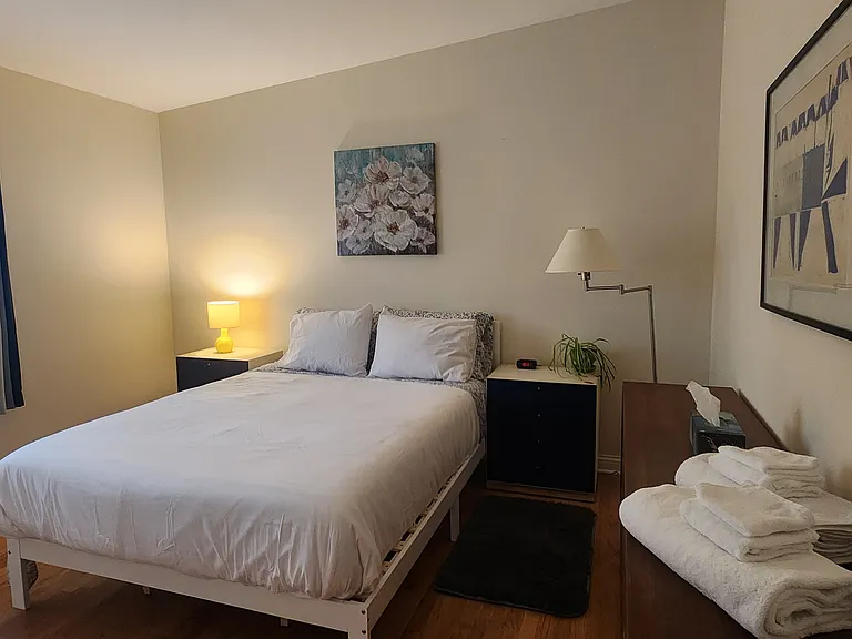 Master Bedroom includes a new queen-sized bamboo/charcoal/green tea memory foam bed, two nightstands, a dresser, two lamps, artwork, two rugs and two closets.