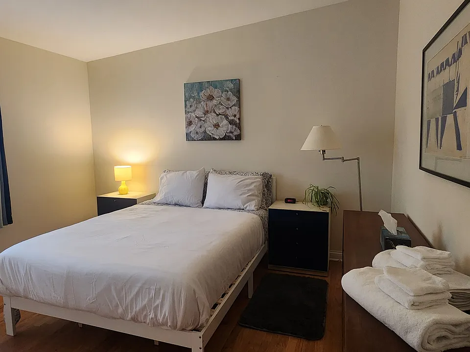 Master Bedroom includes a new queen-sized bamboo/charcoal/green tea memory foam bed, two nightstands, a dresser, two lamps, artwork, two rugs and two closets.