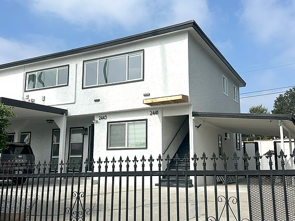 Exterior View of the Duplex. First-floor Unit is Owner-occupied. The upstairs unit is available for rent.