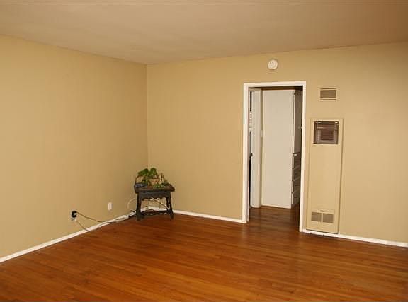 Spacious front room with wood floors