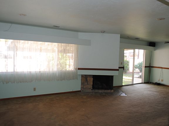 Large living/great room with fireplace on middle floor