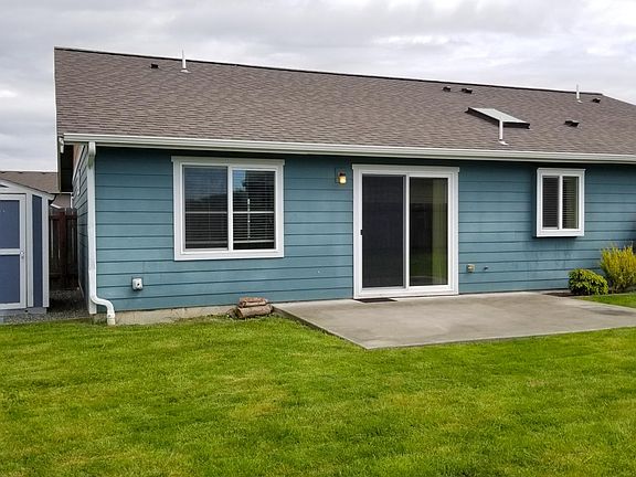 Slider to backyard and patio. Storage shed in backyard
