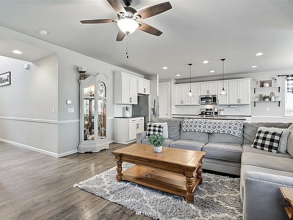 View from family room to kitchen, open-concept and hall from entry to your left. >
