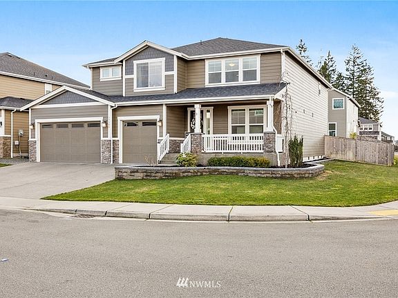 Situated on an idyllic corner lot, this spacious home has been lovingly maintained - inside and out.