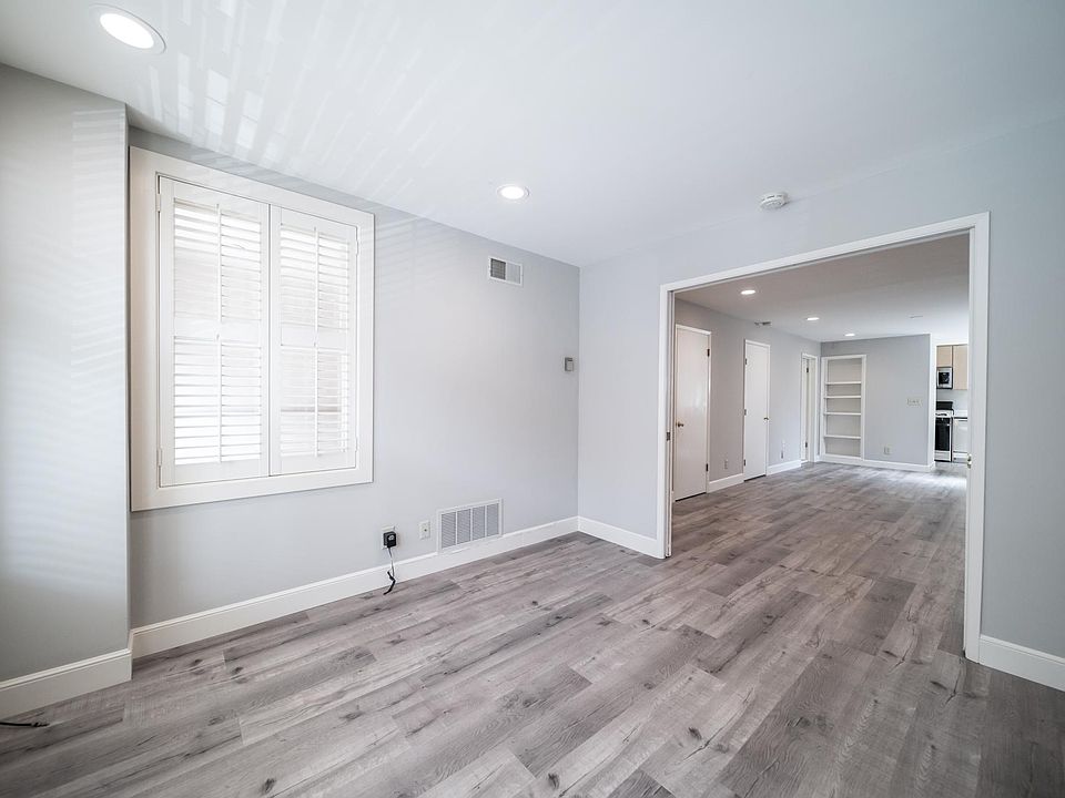 Bedroom with living space beyond pocket doors