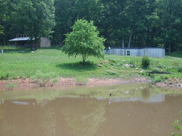 View of home and pond from road