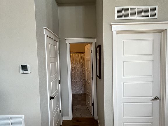 1st guest bathroom center, 1st guest bedroom entrance on the right, linen closet on the left
