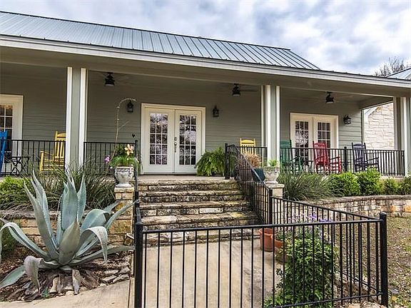 Such a welcoming entry.  Front yard has a secondary fence to keep animals in or out!