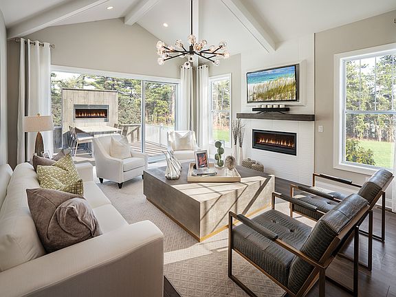 Great room opens to deck, both featuring fireplaces