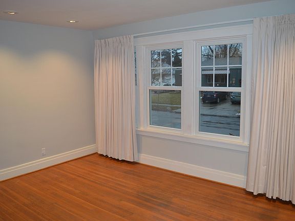 Front room featuring large windows