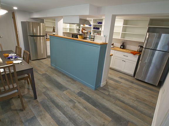 The kitchen and dining area. Notice there are 2 full-sized fridges for a 2-cook kitchen