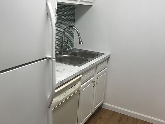 Kitchen with fridge and dishwasher