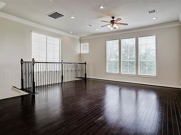 Hardwood floors throughout the second floor living space and wonderful natural light! These windows overlook the greenbelt and dedicated green space behind (no direct back neighbors!)