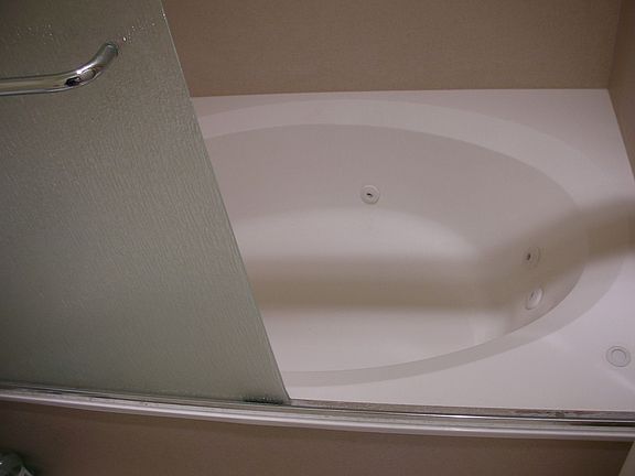 Upgrade -- Jacuzzi Tub w/ Corian style walls