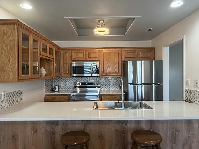 Updated kitchen appliances and quartz countertops.