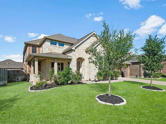 Stacked stone & Brick Exterior, 3 car garage w/ a long driveway for additional parking!
