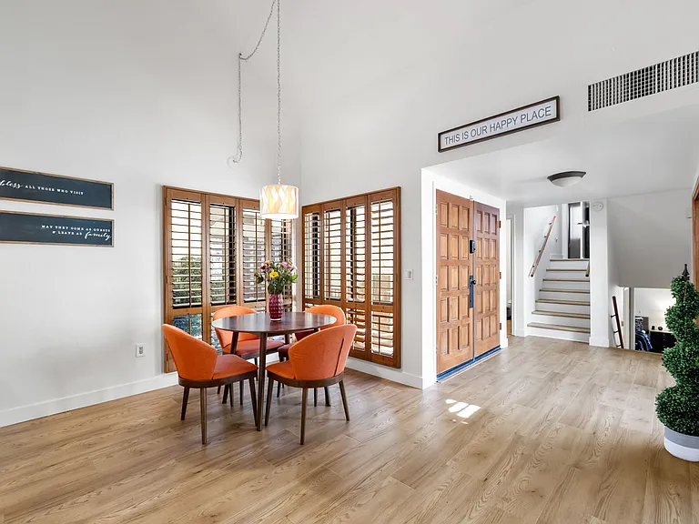The dining area opens to the living and sitting rooms, creating a open floor plan.