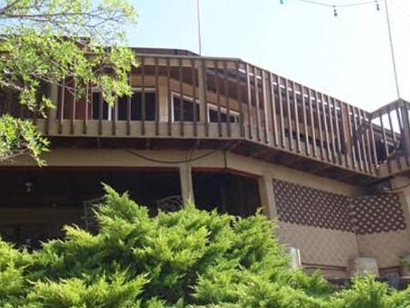 Private deck surrounds rear