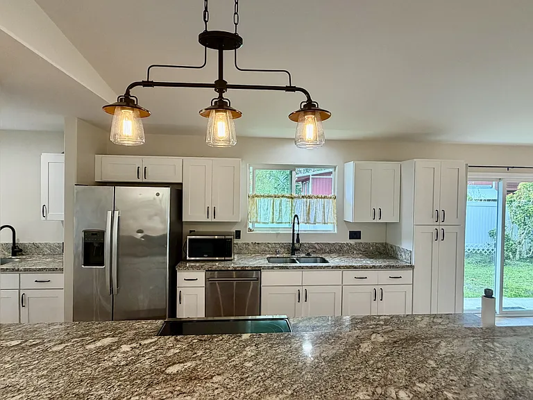Kitchen includes microwave & dishwasher- plenty of storage/counter space & breakfast bar