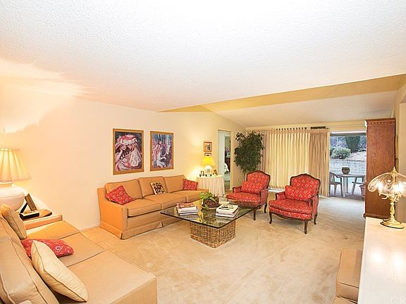 Bright spacious living room with sliders to rear p