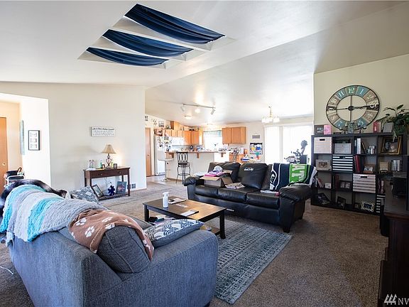 Living room/entry with vaulted ceilings and skylights!
