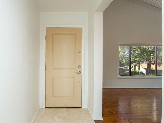 Front door from within the home. Living room on the right.