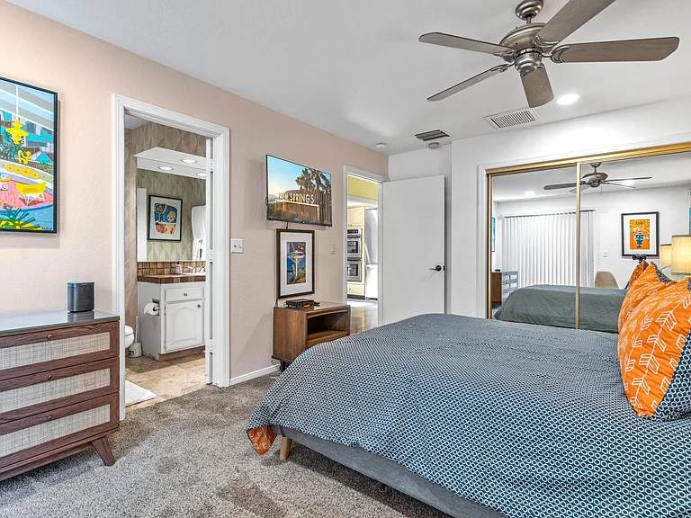 Third bedroom with Smart t.v. facing en suite bath.