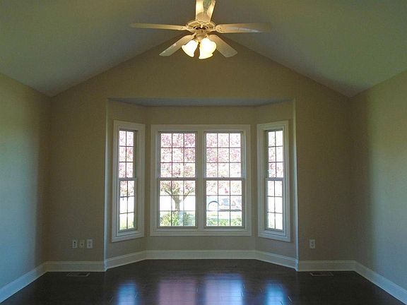 Large office with bay windows and french doors