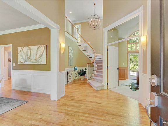 Grand foyer with hardwoods and tons of natural light. >
