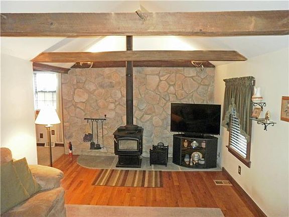 Hardwood floors & woodstove in living room