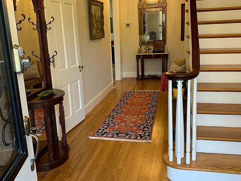 Entrance to main foyer with stairs to upstairs 5 bedrooms & 3 full bathrooms