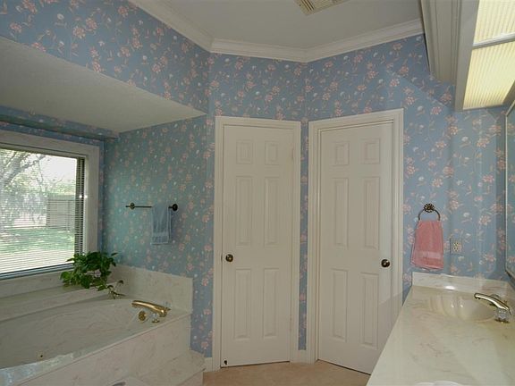 LARGE MASTER BATH BOASTS DUAL SINKS, SHOWER AND WHIRLPOOL TUB,HIS AND HERS CLOSETS