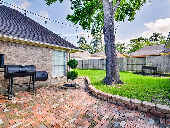 Back yard Paver patio off the house cement patio
