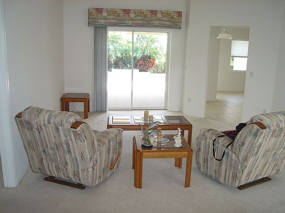 Living room overlooking screened in pool