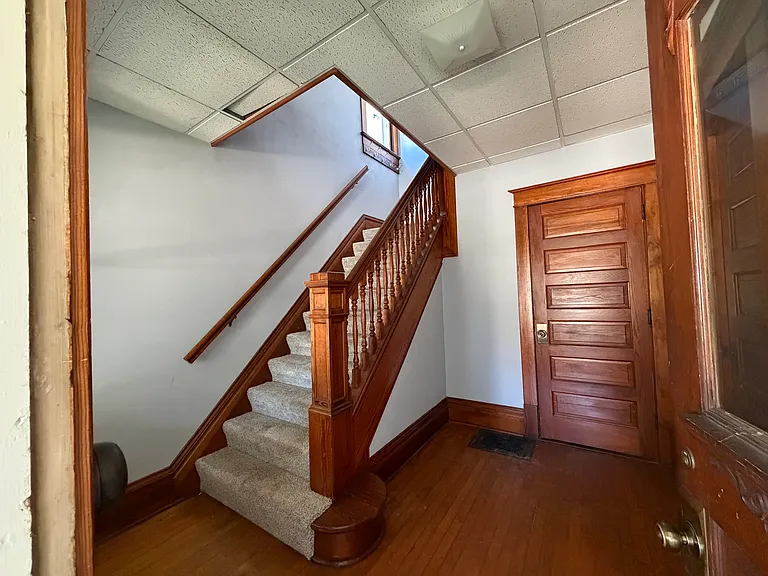 Stairway to upstairs unit (104)